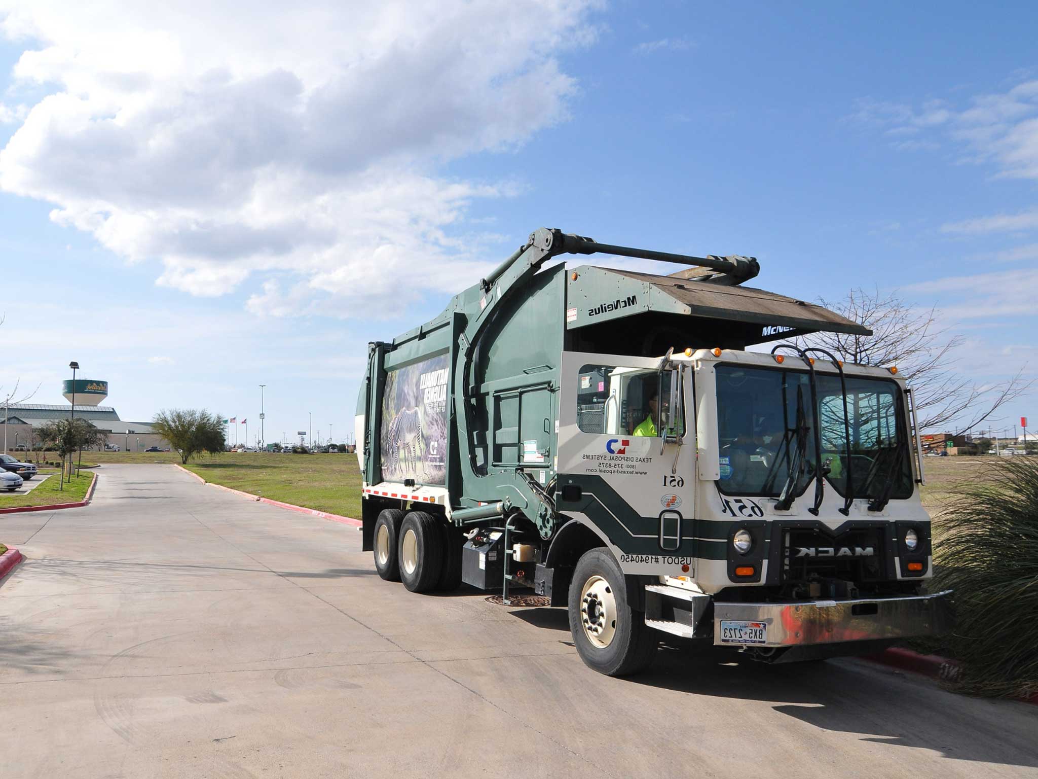 Texas Disposal Systems dumpster truck.