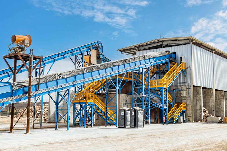 Blue and yellow construction and demolition recycling facility in Creedmoor