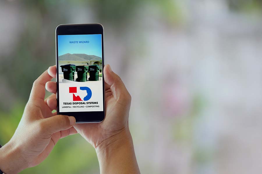 TDS waste wizard app on iPhone with hands holding it